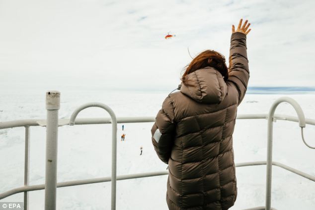 Today, passengers waved as a helicopter sent from China's retreated Snow Dragon flew by to check the snow levels. Autralia's back-up vessel, the Aurora Australis, is expected to arrive tonight but if that fails, helicopters may be sent to the rescue