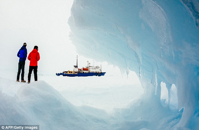 This image, taken by passenger Andrew Peacock, shows the ship MV Akademik Shokalskiy still stuck in the ice off East Antarctica, as it waits to be rescued